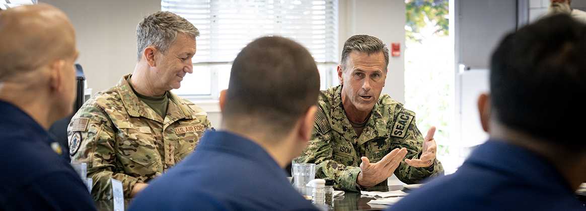 SEAC speaks with service members while Chairman looks on